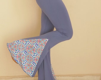 May include: Blue flared pants with a colorful patterned trim at the bottom of the legs.