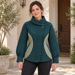 May include: A dark teal quilted jacket featuring a high collar with two gold-tone buttons, long sleeves with cuffs, and light sage green side panels. The jacket has a leaf-patterned stitching design throughout the dark teal fabric.