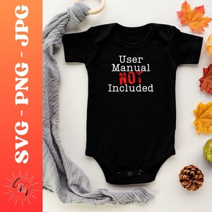 May include: Black baby onesie with white text that reads "User Manual NOT Included". The text "NOT" is in red.