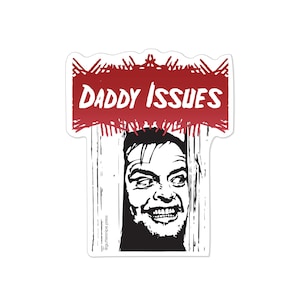 May include: A sticker with a red and white background featuring a black and white illustration of a man's face with the text "Daddy Issues" in red.