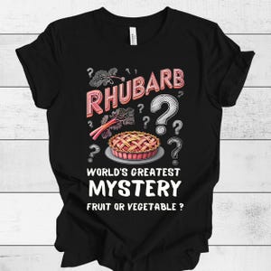 May include: Black t-shirt with a white graphic of a rhubarb pie and the text "Rhubarb? World's Greatest Mystery Fruit or Vegetable?"