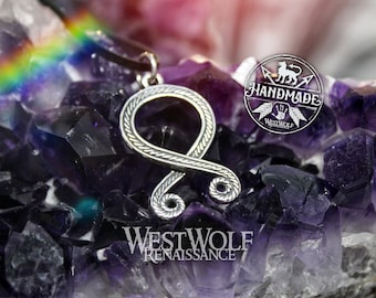 May include: Silver pendant necklace featuring the Vegvisir symbol, a Norse directional symbol, on a black cord. The pendant is surrounded by amethyst crystals. The text "Handmade" and "Westwolf Renaissance" is visible in the image.
