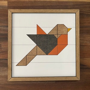 May include: Geometric wooden bird wall art with a brown, orange, and black color scheme. The bird is made of individual wooden pieces that are assembled to create a geometric design.
