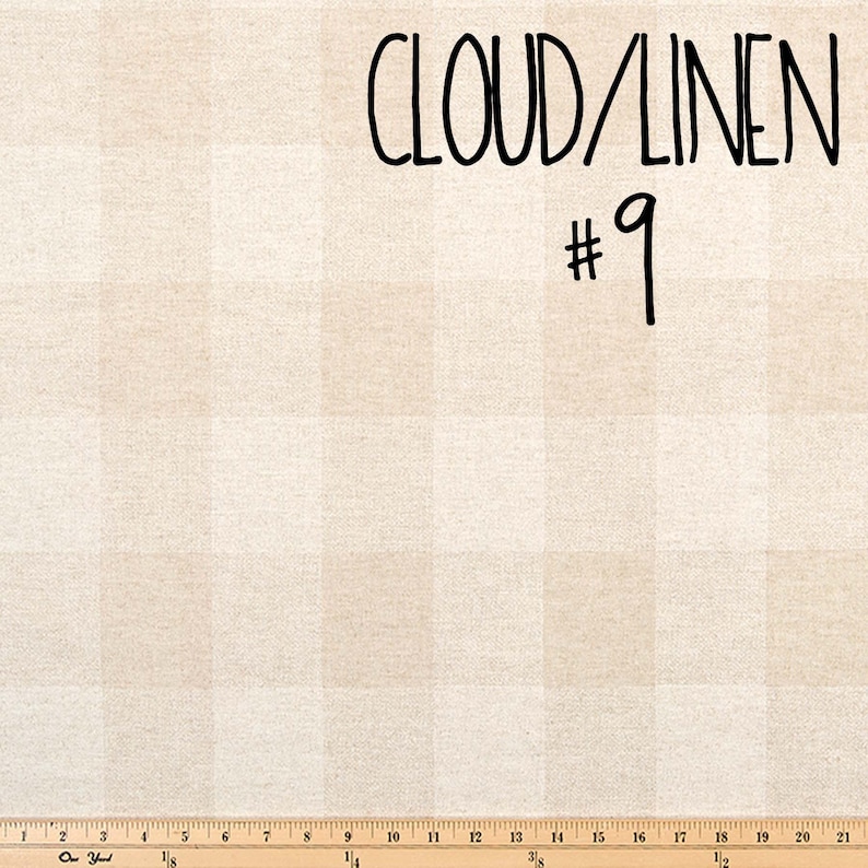 May include: A close-up of a beige fabric with a subtle checkered pattern. The fabric is labelled "CLOUD/LINEN #9".