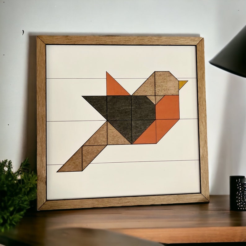 May include: Geometric wooden wall art featuring a stylized bird in shades of brown, orange, and black. The bird is framed in a natural wood frame.