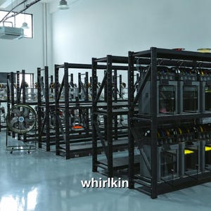 May include: A large industrial space featuring multiple rows of black metal shelving units filled with numerous 3D printers and filament spools. A portable circular fan stands on the floor near the shelves. The text whirlkin is visible.
