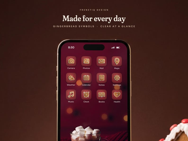 Close view of the Gingerbread Classic home screen on a phone: white-iced gingerbread symbols on cranberry red tiles with clear labels over the hot cocoa and gingerbread man wallpaper.