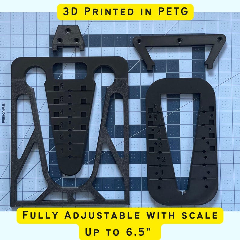 May include: A black 3D printed phone stand with adjustable height, printed in PETG plastic. The stand is fully adjustable with a scale up to 6.5 inches.