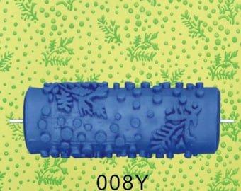 May include: Blue paint roller with a pattern of leaves and circles. The roller is on a green and yellow background with a small white text label that says "008Y".