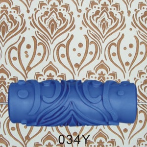 May include: A blue patterned paint roller with a decorative design. The roller is shown against a background of a repeating brown and white pattern. The text "034Y" is at the bottom.