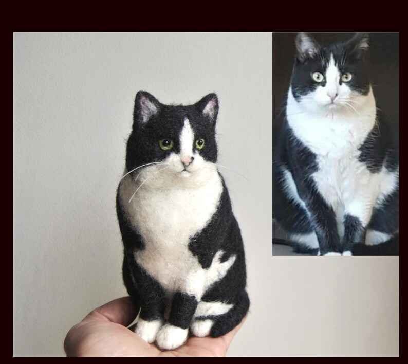 May include: A needle-felted sculpture of a black and white cat with green eyes, modeled after the photograph of a real cat shown in the upper right corner. The sculpture features a white chest and face markings with black ears and back.