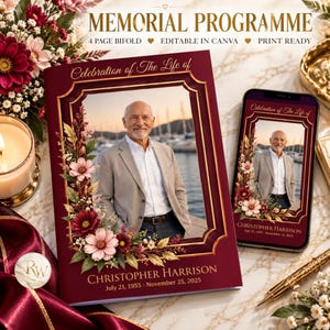 May include: A burgundy memorial programme bifold featuring a gold-framed portrait of a man in a blazer, floral accents, and the text "Celebration of The Life of CHRISTOPHER HARRISON July 21, 1955 - November 25, 2025" displayed on paper and a smartphone.