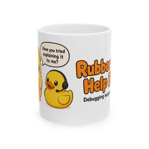 May include: A white ceramic mug featuring a yellow rubber duck wearing a headset. A speech bubble above the duck reads, "Have you tried explaining it to me?" The text "Rubber Help D" and "Debugging support" is printed in orange and black letters.