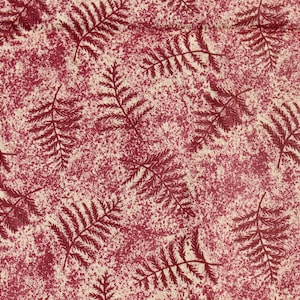 May include: A textile featuring a repeating pattern of burgundy fern leaves set against a cream-coloured backdrop. The background has a speckled, textured appearance, adding depth to the design. The fern leaves are detailed and create a botanical theme.