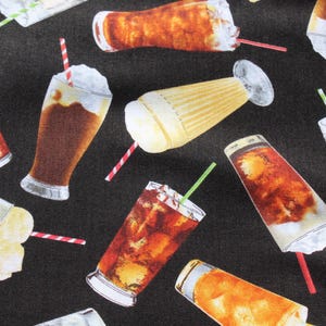 May include: A repeating pattern on a black background, featuring illustrations of various cold drinks such as root beer floats, iced tea, and milkshakes. Each drink is shown with a straw and whipped cream, creating a refreshing design.