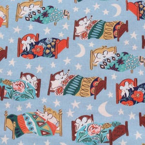 May include: A light blue fabric with a repeating pattern of cartoon mice sleeping in beds. The beds are brown and orange, with colorful bedding. White stars and crescent moons are scattered across the background.