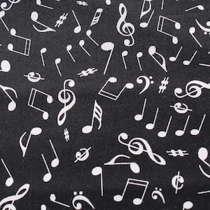May include: Black fabric with a repeating pattern of white musical notes, treble clefs, and sharp symbols. The design features various sizes and orientations of musical symbols, creating a dynamic and artistic look. Ideal for music-themed projects.