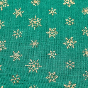 Christmas Fabric by the Yard - Gold Snowflakes on Green - Holiday Material for Stocking Sewing Quilting