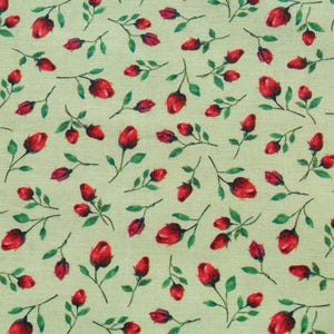 May include: A green fabric with a repeating pattern of red roses. The roses are stylized and have a simple design.