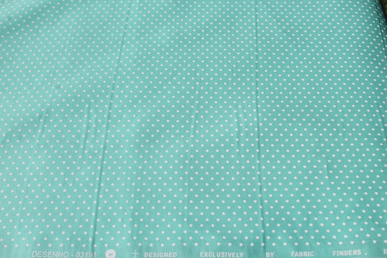 May include: Teal fabric with a white polka dot pattern. The fabric has the text "DESENHO - 03191" and "DESIGNED EXCLUSIVELY BY FABRIC FINDERS" printed on the bottom.