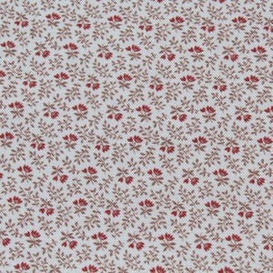 May include: Close-up of a fabric with a repeating floral pattern. The design features small red flowers and brown leaves on a white background. The fabric has a textured appearance, suitable for various craft projects.