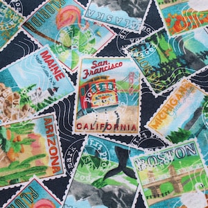 May include: Fabric with a repeating pattern of colorful postage stamps featuring various US states and landmarks. Stamps include images of a trolley car, a swan, and a flamingo. The stamps are set against a dark blue background.