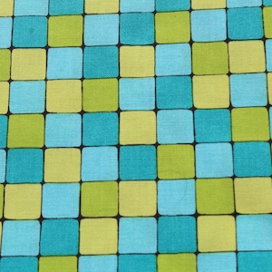 May include: A fabric with a checkered pattern in shades of blue, green, and yellow.