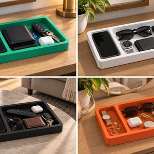May include: A rectangular valet tray with two distinct compartments for organising small personal items. The tray is available in four solid colours: green, white, black, and orange. Each tray holds various accessories like phones, wallets, keys, watches, and sunglasses.