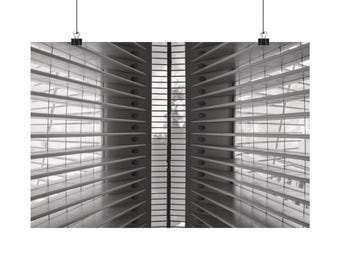 May include: A black and white architectural wall art print featuring a symmetrical perspective of repeating horizontal slats and vertical structural beams, creating a deep sense of depth and geometric patterns within a modern interior space.