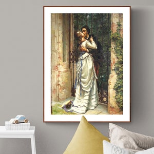 May include: A framed print of a romantic scene. A man and woman embrace and kiss in front of a wrought iron gate. The woman wears a white dress with blue accents. The artwork has a vintage aesthetic.