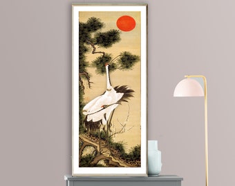 May include: A vintage Japanese painting of two white cranes standing on a branch of a pine tree. The background is a pale yellow with a red sun.
