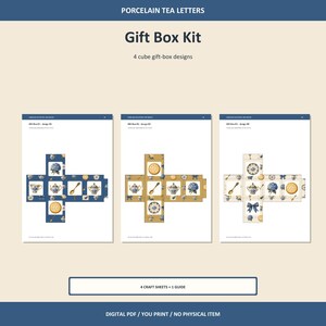 May include: A digital gift box kit featuring porcelain tea letters with four cube gift-box designs. The kit includes four craft sheets and one guide, displaying patterns of teapots, cups, spoons, biscuits, blue flowers, and bows on blue, gold, and white backgrounds.