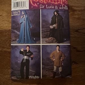 May include: A sewing pattern for four different costumes. The pattern is for teens and adults. The costumes include a blue robe, a black robe, a black and white martial arts outfit, and a brown and white robe.