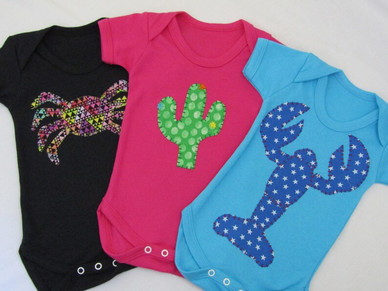 bright coloured baby vests