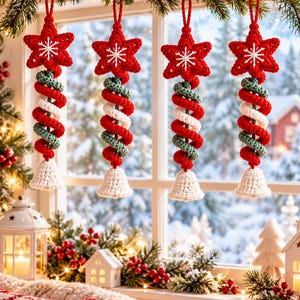May include: Four hanging crochet ornaments featuring a red star top with white embroidered snowflake detail, a central spiral column of red, white, and green yarn, and a small white bell at the bottom, suspended by red yarn loops.