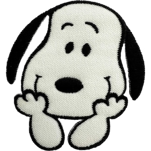 May include: An embroidered patch featuring a white cartoon dog with black ears, a black nose, and black eyes. The dog is depicted with its head resting on its two front paws, showcasing a simple, clean design with a thick black stitched border.