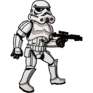 May include: An embroidered patch featuring a white and black stormtrooper character in full armor. The figure is depicted in a standing position, holding a black blaster rifle in one hand, with detailed stitching outlining the helmet and suit.
