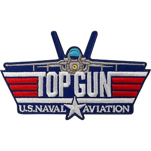 May include: A navy blue embroidered patch featuring a fighter jet silhouette at the top with a light blue cockpit. The text TOP GUN is in white with red horizontal stripes on each side. Below, U.S. NAVAL AVIATION is written with a white star.