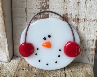 Fused glass snowman ornament with red earmuffs