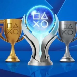 May include: A central glowing blue orb trophy featuring the PlayStation symbols square, triangle, circle, and cross, flanked by two gold, one silver, and two bronze trophies, each engraved with the same four PlayStation controller button symbols.