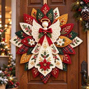 May include: A quilted fabric angel wall hanging featuring a layered petal design in red, green, gold, and cream. The angel has a gold halo, white wings, and a red bow. The fabric is decorated with embroidered poinsettias, holly, and snowflakes.