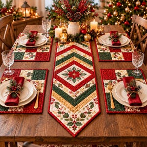 May include: A quilted table runner and four matching placemats featuring a red, green, and cream geometric pattern with poinsettia and holly motifs. Each place setting includes a white plate, a red napkin, a gold fork, and a glass goblet.