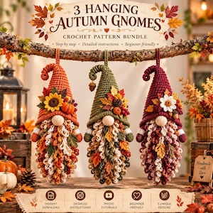 May include: Three hanging crochet gnomes with autumn-themed decorations including sunflowers, pumpkins, and leaves. The text reads 3 HANGING AUTUMN GNOMES CROCHET PATTERN BUNDLE. The gnomes have long, curly beards and pointed hats in orange, green, and burgundy.