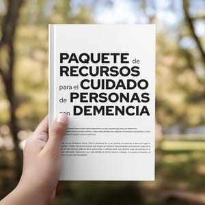 May include: A white book with black text on the cover that reads PAQUETE de RECURSOS para el CUIDADO de PERSONAS con DEMENCIA, followed by smaller paragraphs of Spanish text detailing information for caregivers of individuals with dementia.
