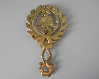 Vintage brass rivet with an eagle