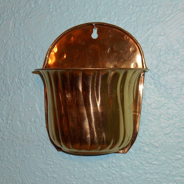 Vintage brass wall planter from the 1970's