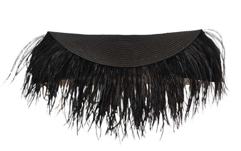 May include: A black feather trim headband with a woven straw band.