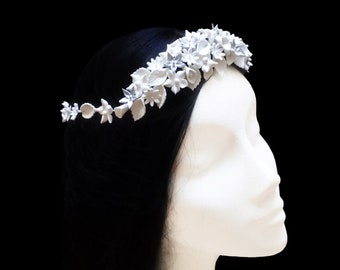 White bridal crown with porcelain flowers and leaves