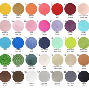 May include: Colour chart featuring 35 different colours of round placemats. The colours are arranged in rows and columns, with each colour labelled with its name in Spanish and English.