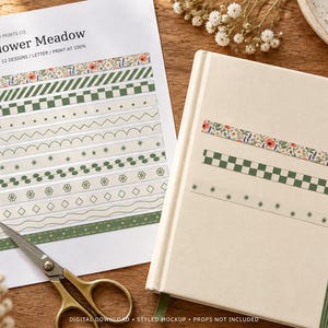 May include: A digital print sheet titled Wildflower Meadow featuring 12 designs of 6 mm width washi tape patterns including floral, checkered, and geometric motifs, alongside a notebook with three applied tape strips and metal scissors.